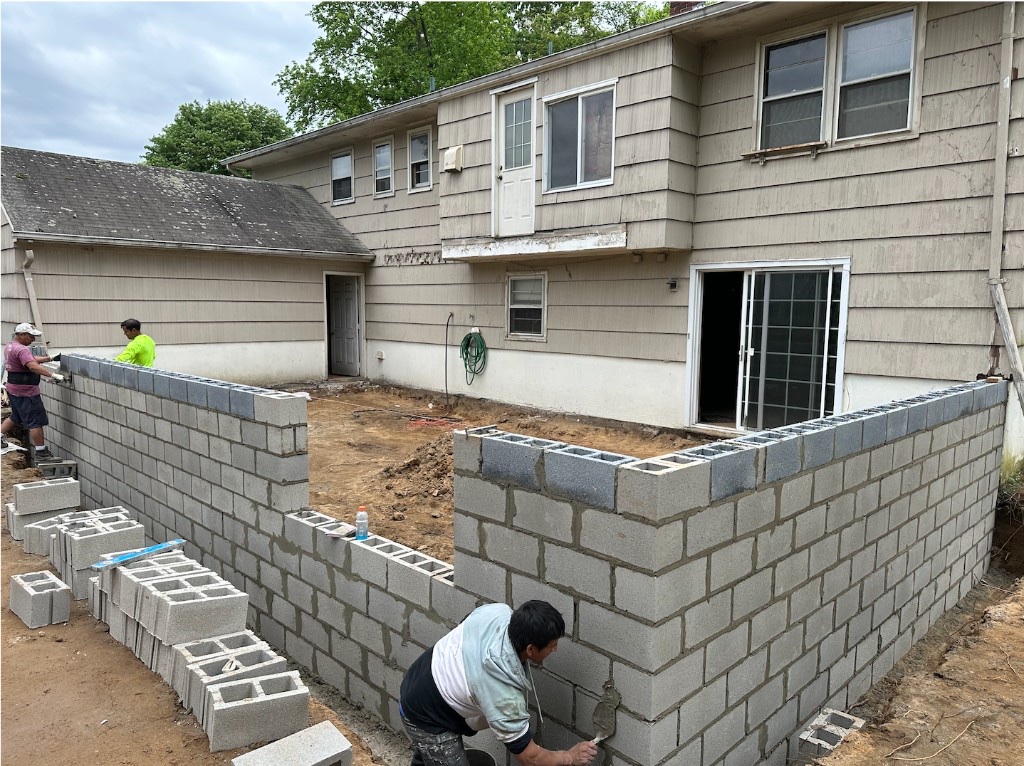 Cinder block retaining walls under construction in Northern New Jersey